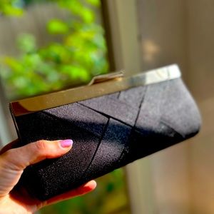 Black date night clutch bag with shoulder strap
